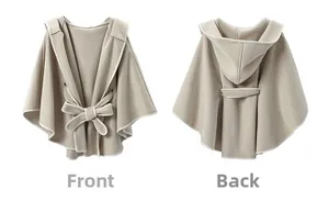 Flat lay of beige hooded poncho for kids showing front bow tie and back hood details