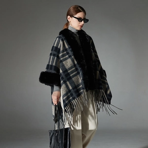 Women's plaid poncho coat in navy blue with elegant faux fur collar and tassels
