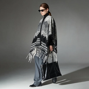 Women's houndstooth wool blend poncho with tassels and geometric knit patterns