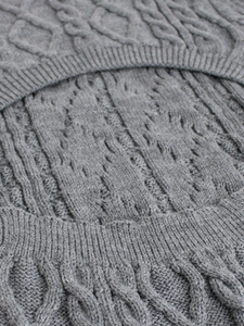 Detail of grey cable knit texture with ribbed cuffs on this long sleeve dress