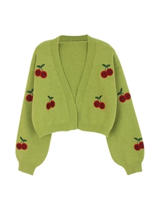 Detail of green cropped knit cardigan featuring red cherry embroidery and ribbed cuffs