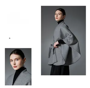 Detail view of a gray wool shawl cloak with a side bow tie and soft premium texture