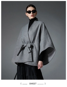 Close-up of grey double-sided wool blend cape coat with tie waist and side slit
