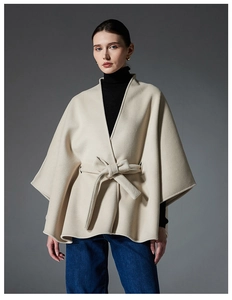 Detail of premium beige double-sided wool shawl coat with belt and wide cuffs