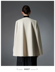 Rear view of cream white woolen sleeveless cape shawl with natural pleated drape