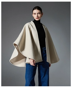 Detailed drape of cream double-sided wool shawl featuring an elegant waist belt design