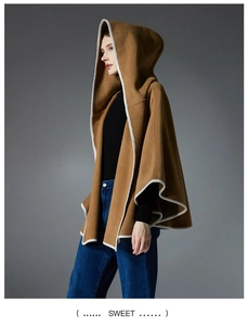 Detail showing the camel wool blend cape coat with ivory contrast piping and elegant hood