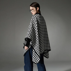 Elegant black and white houndstooth poncho shawl with buckle and black trimmed edges