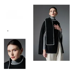 Detail of white contrast stitching on black wool blend cape with elegant urban styling
