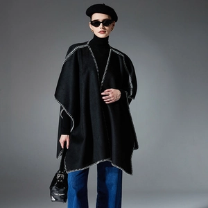 Elegant black wool cape coat for women featuring contrast white stitching and open front