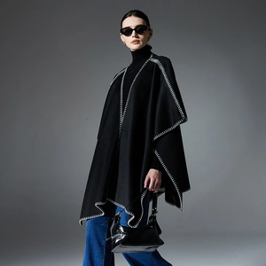 Minimalist black wool cape with white contrast blanket stitching for women's street style