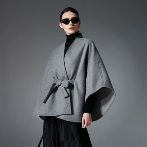Women's dark grey wool-blend cape coat with waist belt and elegant midi length
