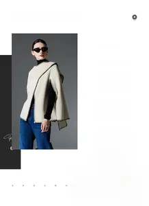 Chic beige knit shawl with black blanket stitching detail in a Nordic minimalist style