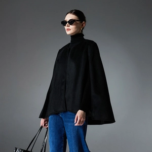 Elegant black cashmere cape coat with sleeveless design for women in casual street style