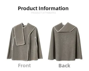 Detail view of double-sided knit poncho with white blanket stitching on gray fabric