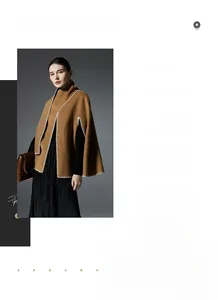 Close-up of camel knit poncho shawl with white contrast stitching and trendy wrap design