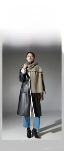 Detailed view of camel double-sided wool shawl with dark brown tassels and fringe