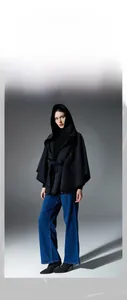 Detail of hooded double-faced wool shawl with waist tie closure for elegant autumn style