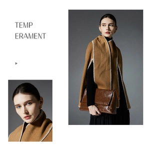 Detail of camel wool shawl with white stitching and luxury brown leather handbag