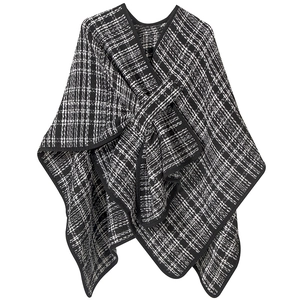 Classic black and white tweed poncho wrap with irregular cut and contrast trim