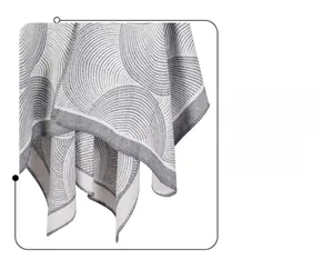 Close-up of geometric jacquard wool shawl showing high-quality gray and white neat edging