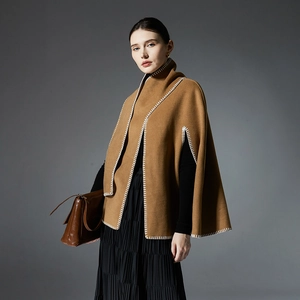 Elegant camel poncho wrap with white blanket stitching and wool-like texture