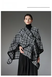 Detail of classic black and white houndstooth wrap shawl with premium piped edges