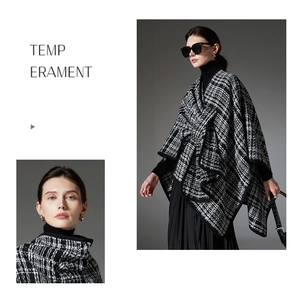 Detailed texture of black and white tweed poncho wrap with elegant checkered pattern