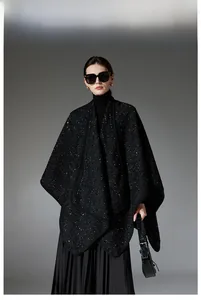 Detail of elegant black wool shawl with sparkling silver sequins and premium edge finish