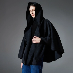 Women's black hooded double-faced wool poncho coat with minimalist oversized silhouette