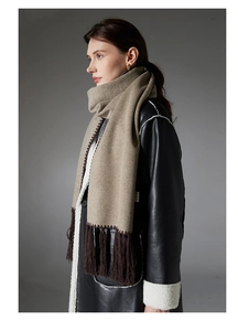 Close-up of solid coffee scarf with dense fringes and high-quality double-sided fleece texture