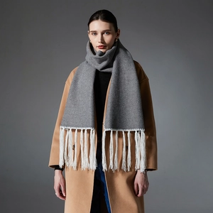 Long grey winter scarf for women with white tassel fringe and warm wool-like texture