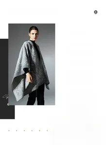 Detail view of paisley pattern on grey wool blend knitted shawl for women