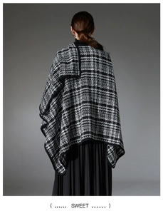 Close-up showing the premium woven texture of black and white tweed check shawl