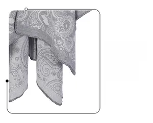 Close-up of gray paisley wool shawl showing neat lock-edge stitching and soft fabric