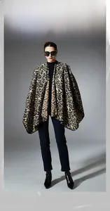 Detailed view of fashionable leopard print knitted shawl with cross-over style for women