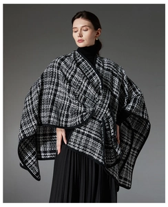 Close-up of black and white tweed plaid shawl with delicate stitched edge detail