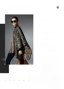 Close-up of leopard print knitted shawl with premium soft texture and contrast border