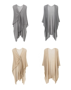 Detail view of thin knitted shawl in gray and beige with elegant knotting techniques