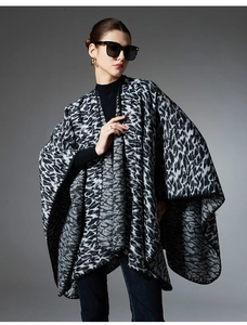 Close-up of leopard print shawl showing the thick knitted texture in grey and black