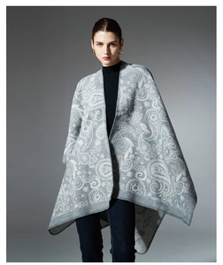 Detailed close-up showing the intricate paisley floral texture of this wool blend shawl