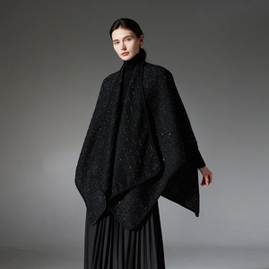 Elegant black tweed shawl with subtle sequins over a long pleated skirt outfit