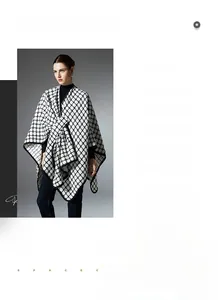 Detail of black and white plaid knit shawl showing crossover wrap and woven texture