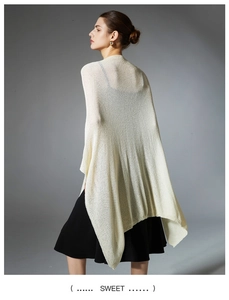 Close-up of off-white mesh knit shawl texture with elegant drape on female model