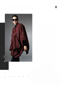 Detail of red and black checkered knit shawl showing fabric texture and sleek black trim