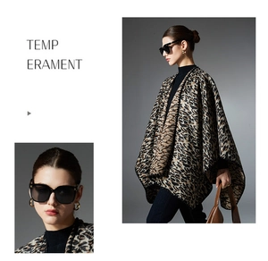 Detailed close-up showing thick leopard print fabric texture and tassel edges of the shawl