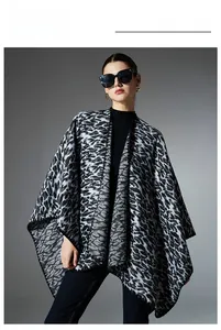 Close-up of soft knitted black and grey leopard print shawl with reinforced edges