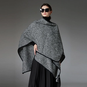 Elegant women's thick wool blend tweed poncho cape with black contrast ribbon edging