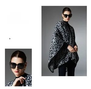 Close-up detail of knitted leopard print shawl showing thick texture and fine stitching