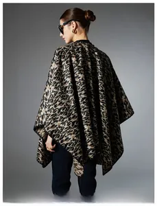 Detail shot of leopard print knit shawl with premium draped back design and black edging